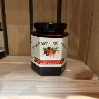 Jar of pickled beetroots on a wooden shelf